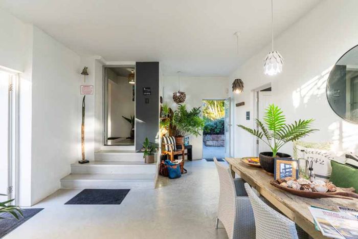 Welcome hallway with plants and reception table