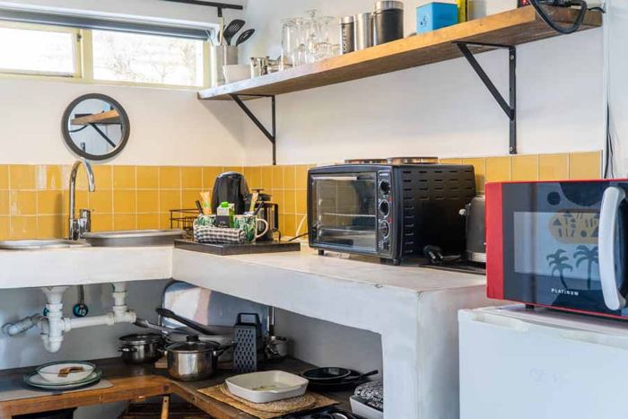 Self-catering kitchenette with yellow tiles in Lemon Cottage