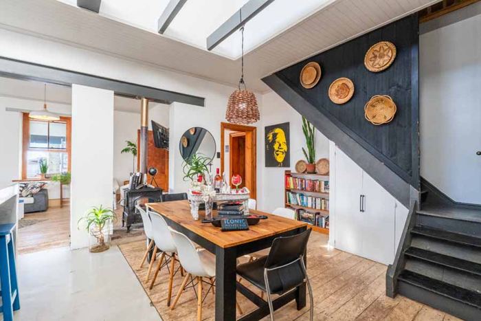 Open-plan dining room and staircase to the loft in the Main Villa